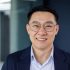 closeup-portrait-successful-asian-man-glasses-business-jacket-smiling-looking-camera_321831-17397